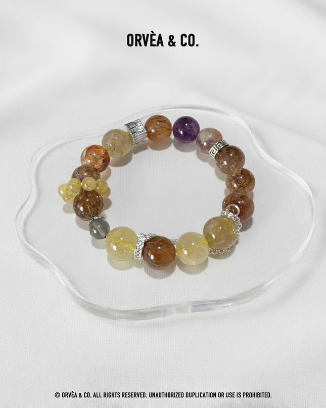 Custom Crystal Bracelet - with Amethyst Phantom Quartz, Golden Rutilated Quartz, Grey Moonstone & Black-Gold Super Seven Quartz - [Standard]