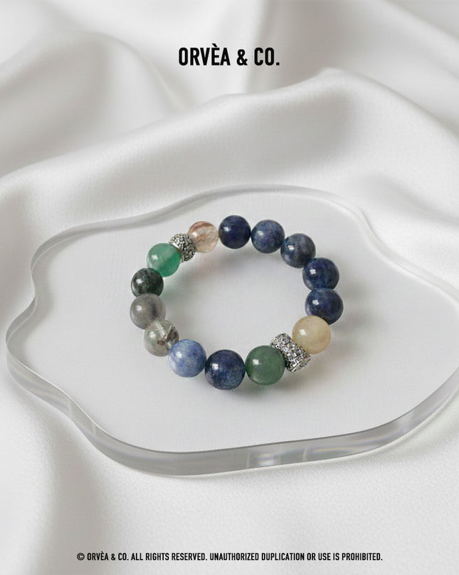 Custom Crystal Bracelet - with Blue Tiger’s Eye, Green & Golden Rutilated Quartz, Kyanite, Black-Gold Super Seven Quartz, Grey Moonstone & Green Phantom Quartz - [Standard]