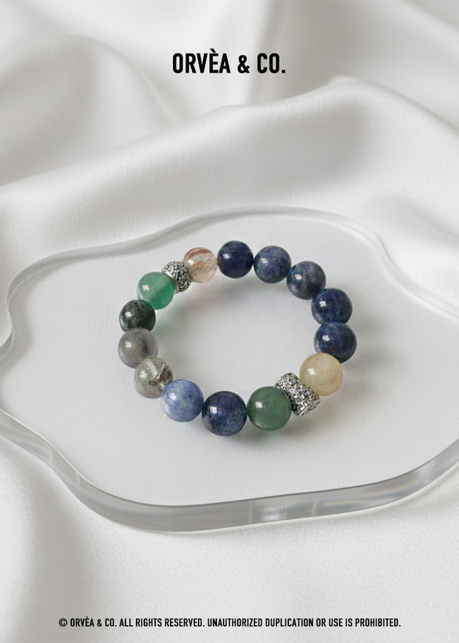 Custom Crystal Bracelet - with Blue Tiger’s Eye, Green & Golden Rutilated Quartz, Kyanite, Black-Gold Super Seven Quartz, Grey Moonstone & Green Phantom Quartz - [Standard]